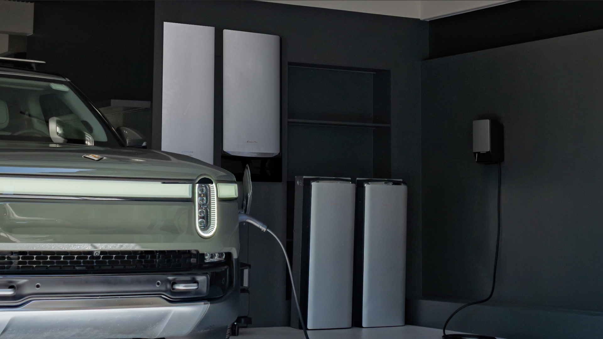 EcoFlow OCEAN Pro Solar Battery System installed in a modern garage, showing wall-mounted and floor-standing battery units actively charging a Rivian electric vehicle.