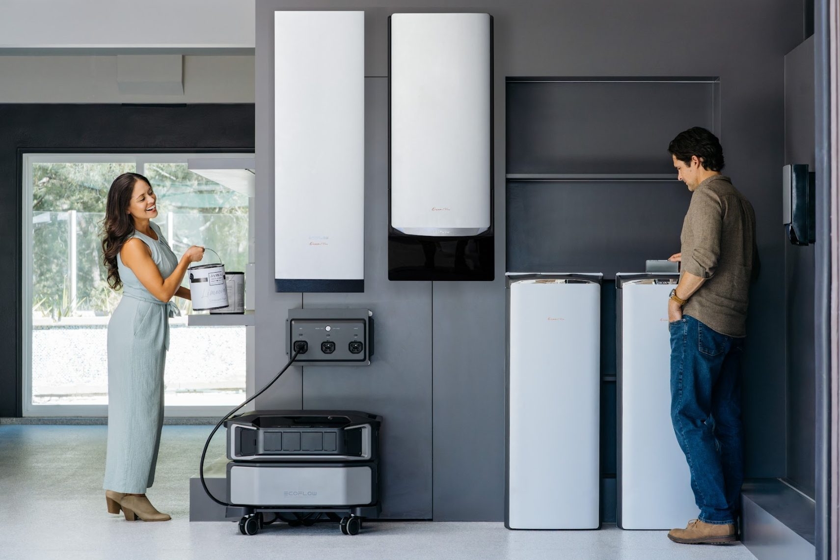 Couple with EcoFlow home battery backup system and wall-mounted power units.