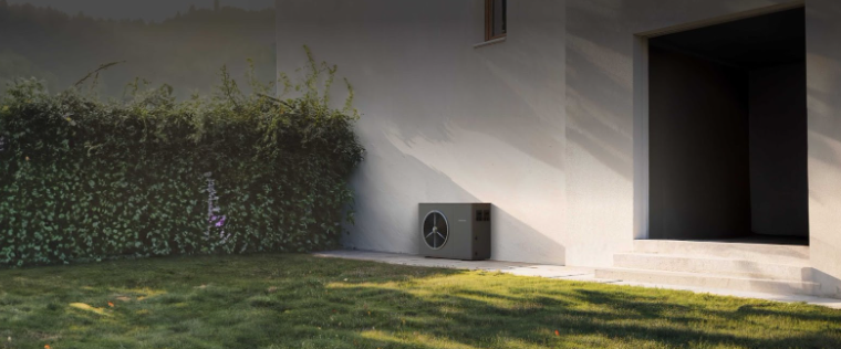 An outdoor unit of a heat pump outside a house