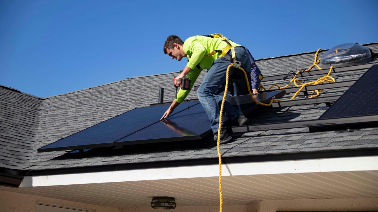 professional worker mounting roof panels