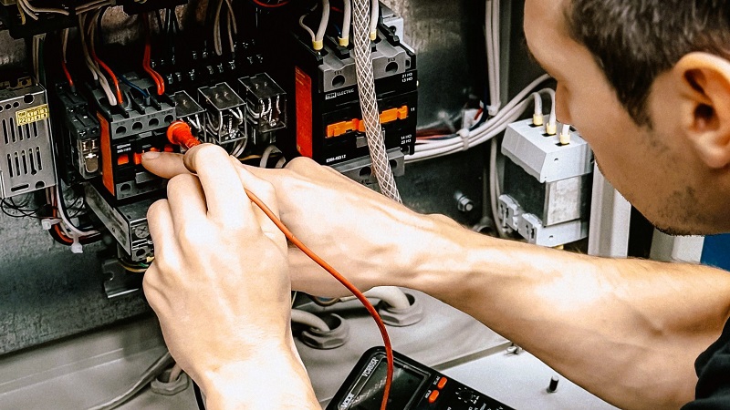A professional electrician fixing an electrical issue